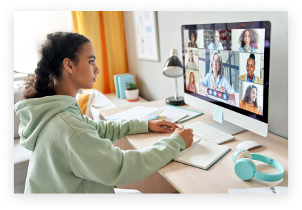 A young girl taking online lessons