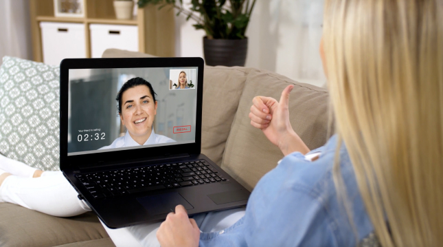 A woman video chatting another woman